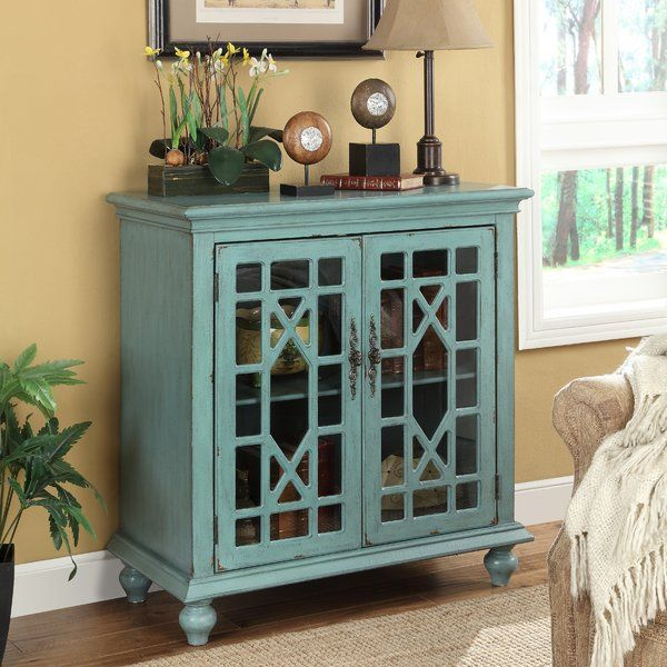 Beyond Storage The Art of Styling Your Blue 2-Door Cabinet
