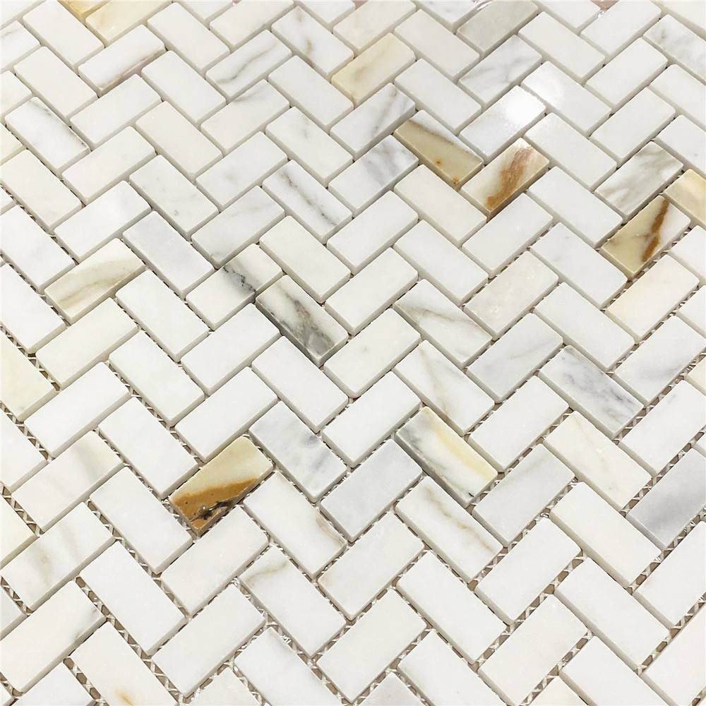 A Closer Look at Calacatta Gold Calcutta Marble Mosaic Tile in Herringbone