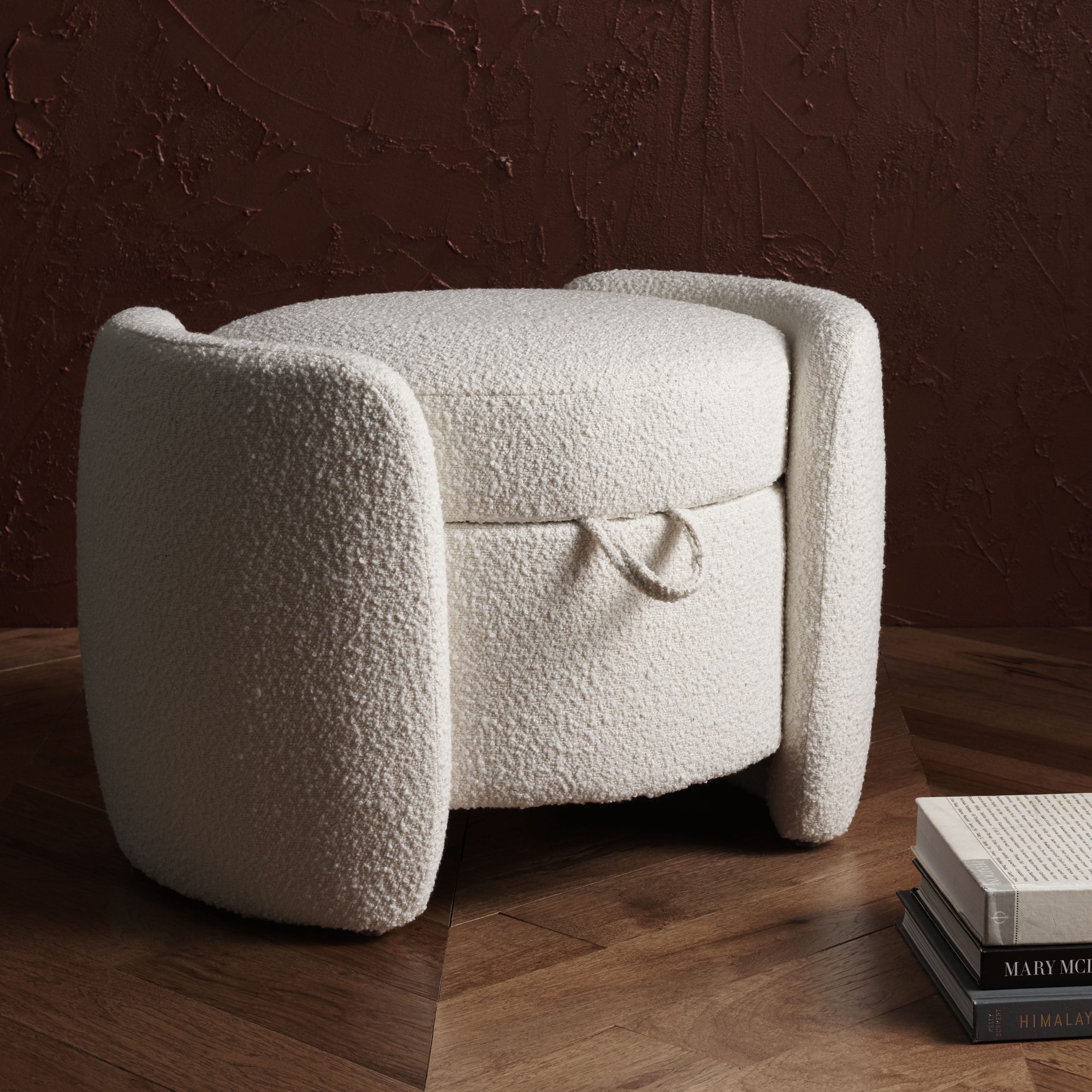 How the Safavieh Danianna Boucle Ottoman in Ivory enhances interior aesthetic appeal