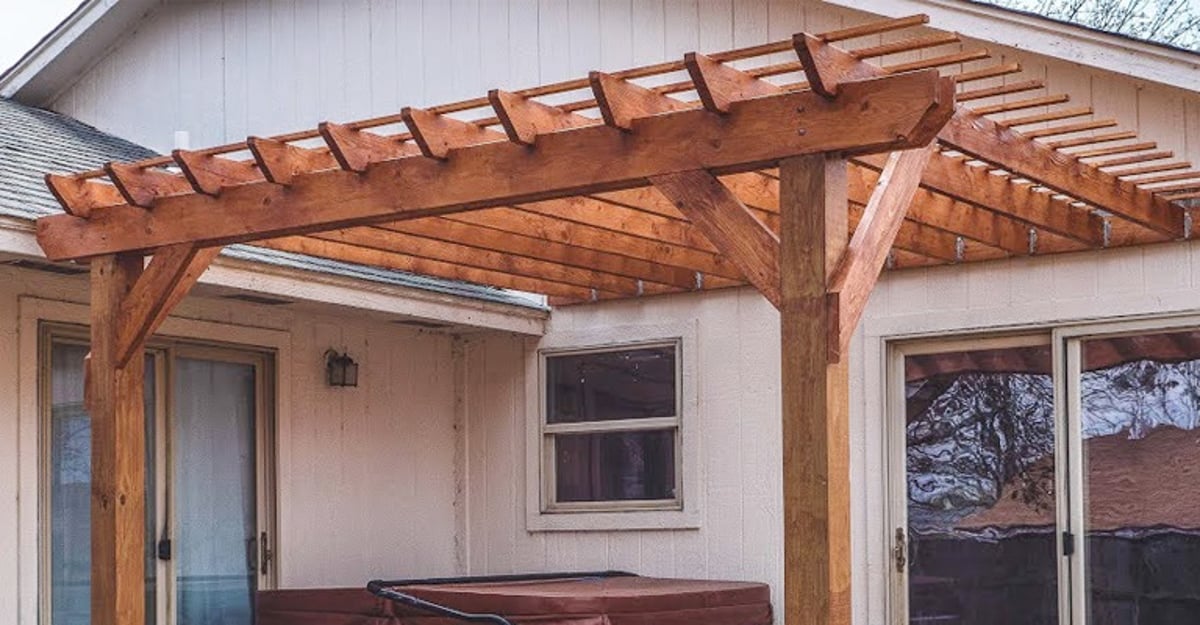 how do you attach a pergola to a house