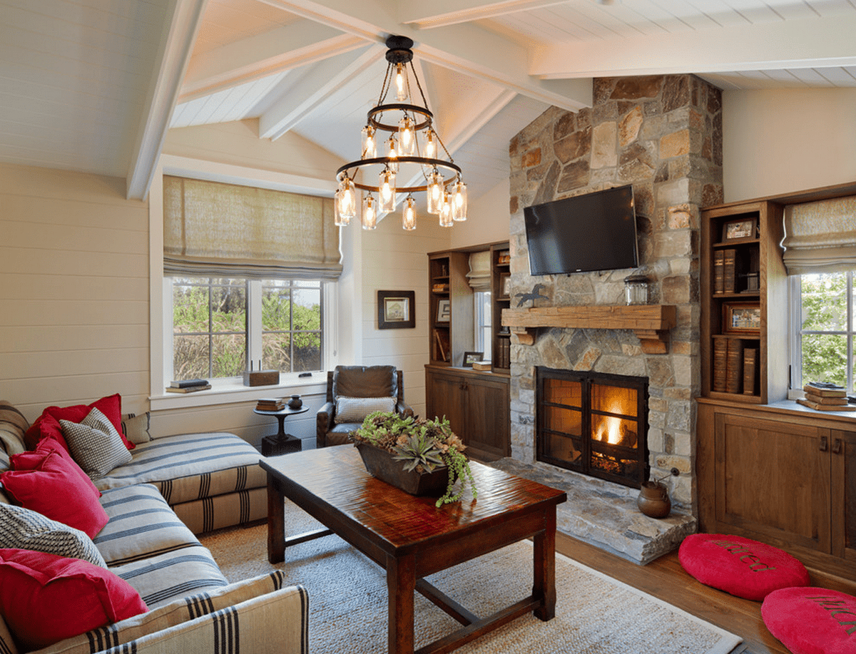 living room with stone fireplace