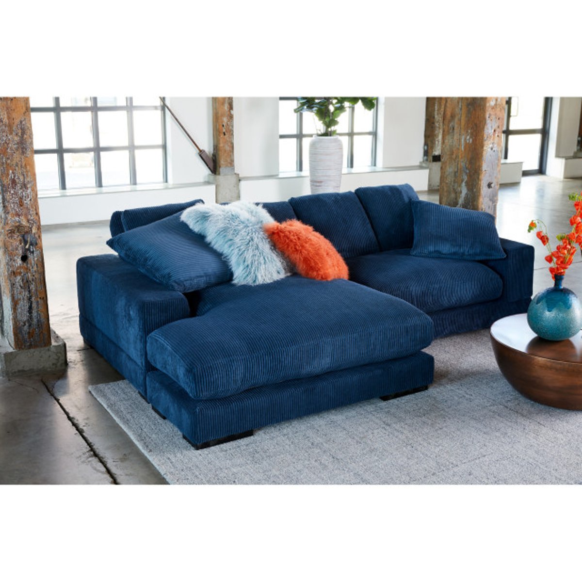 Decoding the Comfort of a 2 PC Blue Corduroy Reversible Modular Sectional Sofa