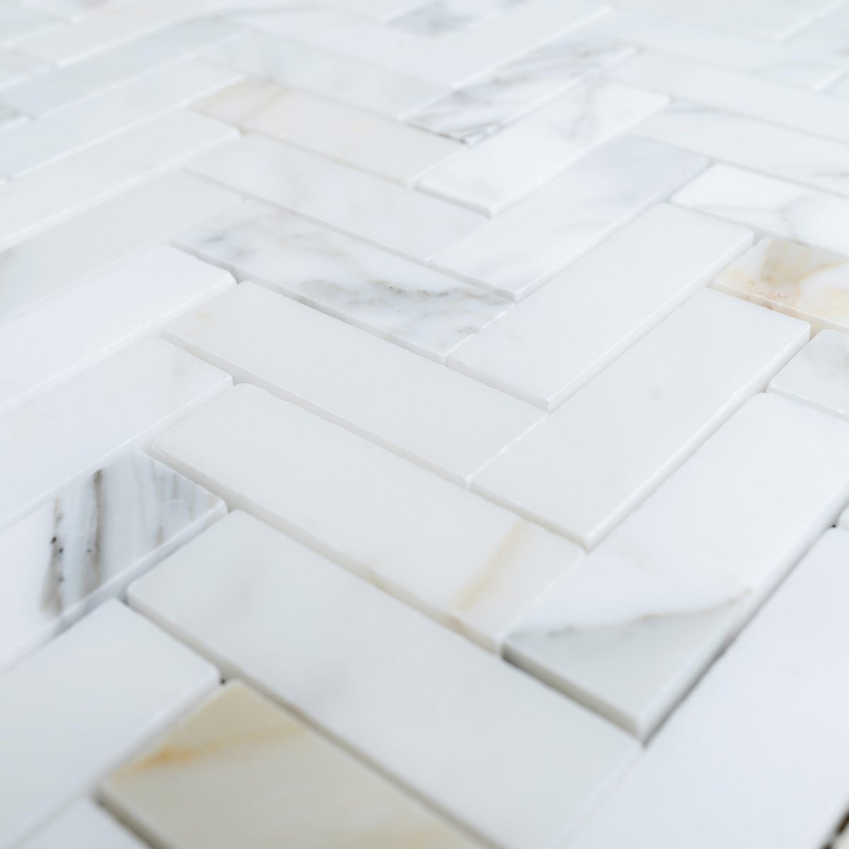 Unveiling the Timeless Elegance of Honed Calacatta Gold Herringbone
