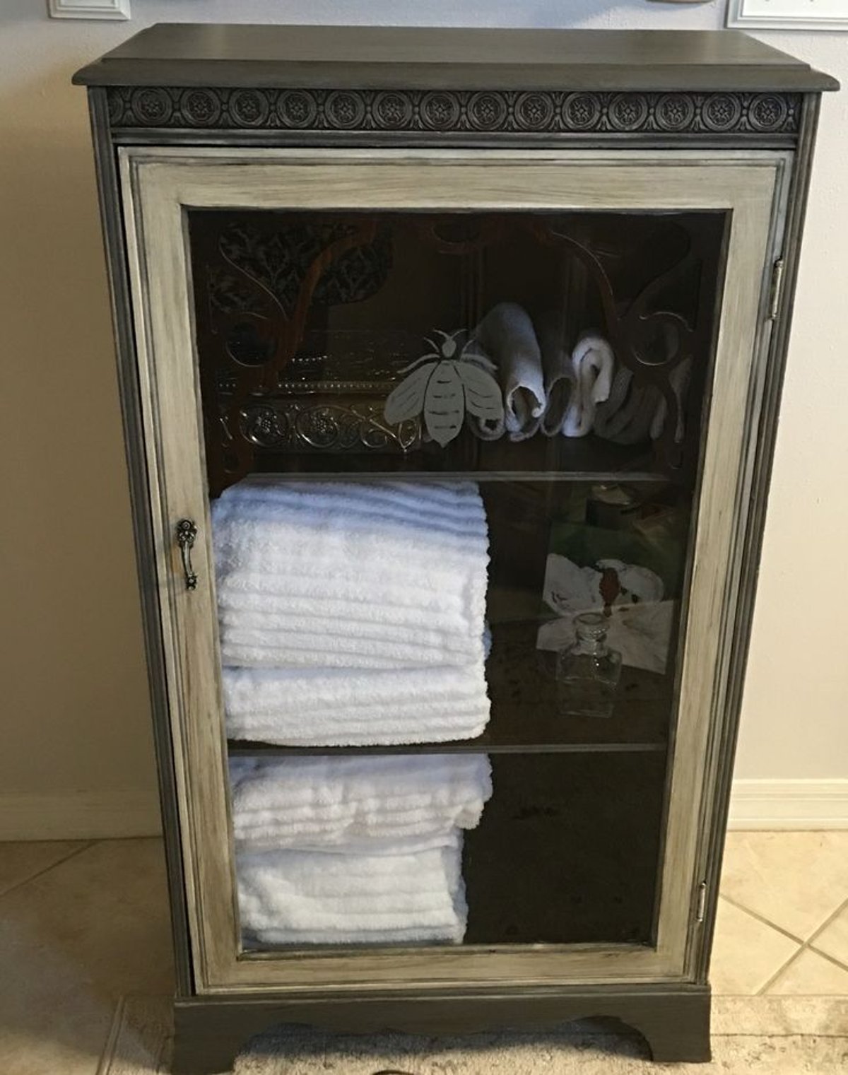 Transform Your Space with a Black and Gold Painted Vintage Cabinet