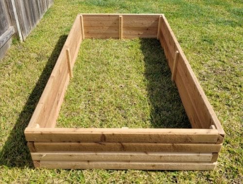 Building a Beautiful and Functional Cedar Plank Raised Bed Garden 3