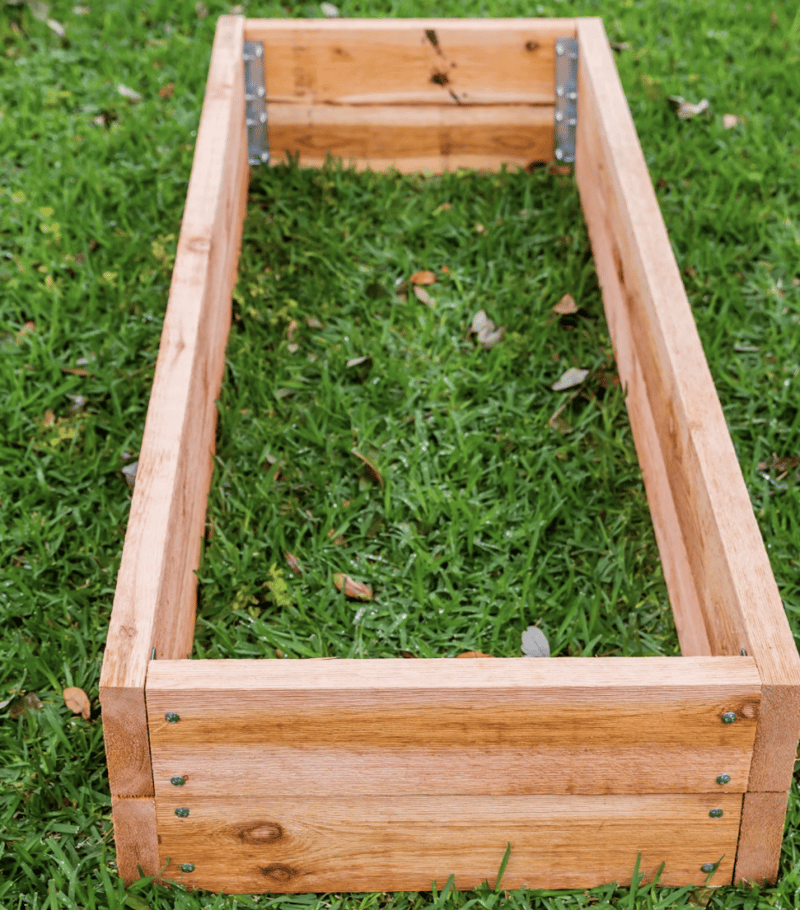 Building a Beautiful and Functional Cedar Plank Raised Bed Garden 4