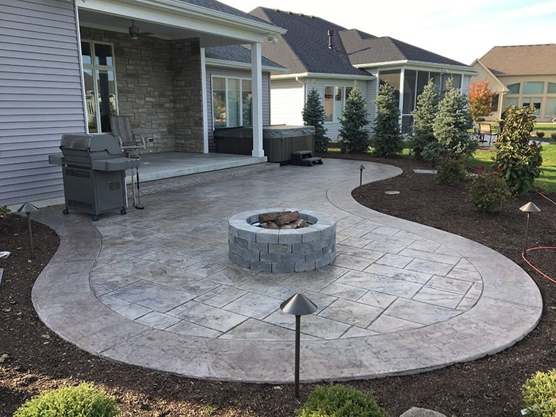 Crafting Your Dream Backyard Oasis with Stamped Concrete and a Firepit 5