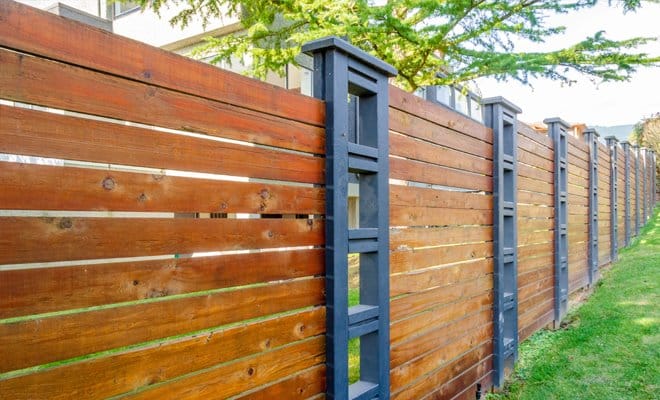 horizontal wood fence with black posts 4
