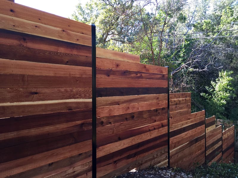 horizontal wood fence with black posts 5