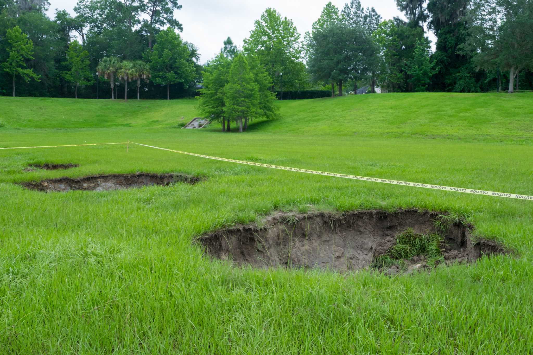 signs of a sinkhole in your yard 3
