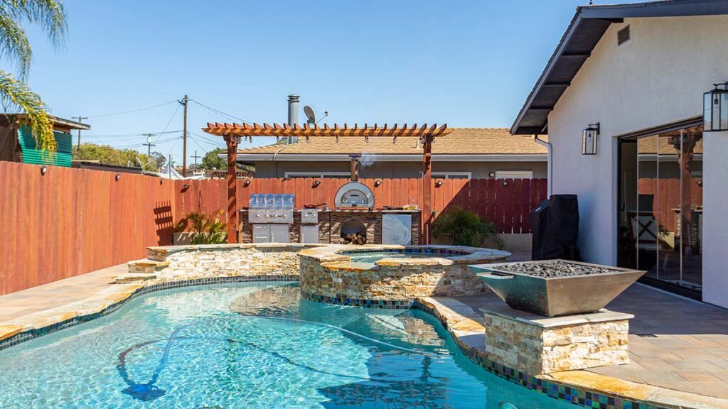 small backyard with pool and outdoor kitchen 5