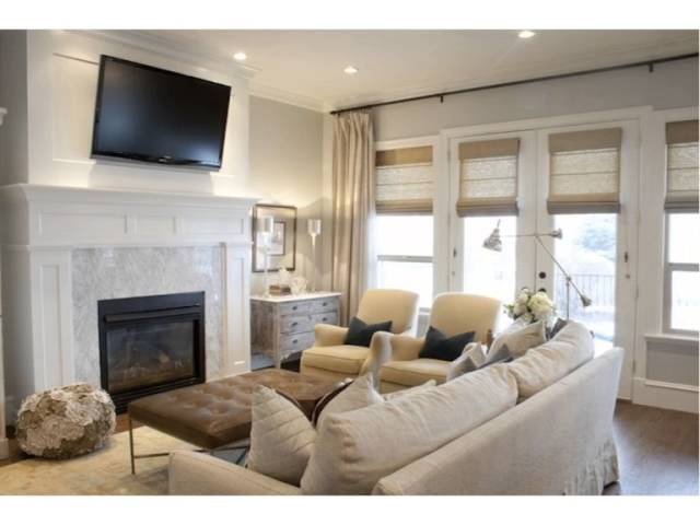 small living room with tv over fireplace 2