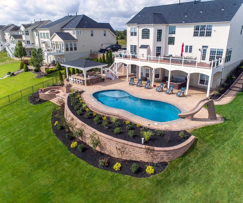 Transforming a Sloped Yard Into Your Dream Inground Pool 1