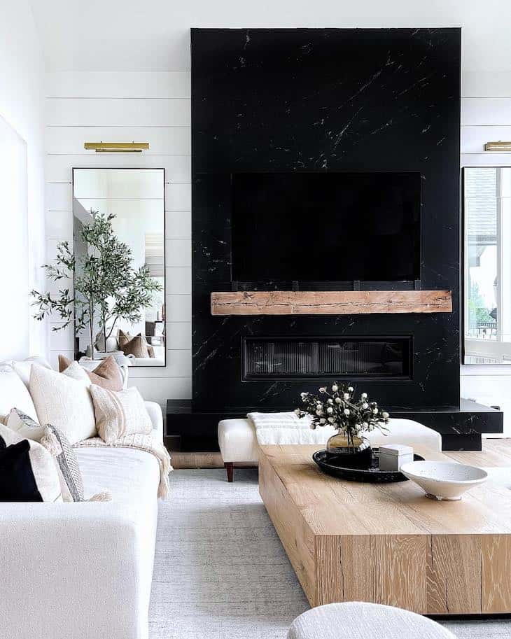 black living room with fireplace